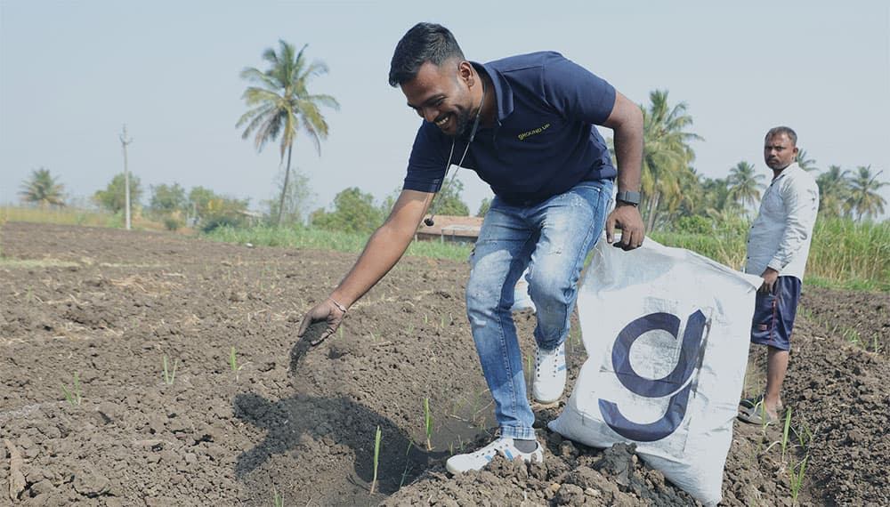 Farmer applying biochar
